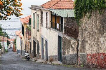 Funchal old town street view with old residential houses. Portugal, Madeira