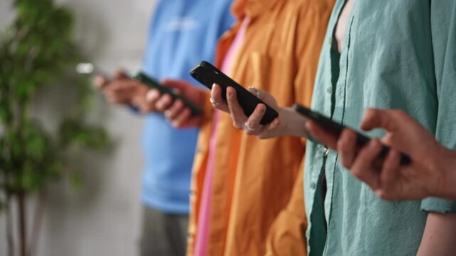 Group of People Engaging with Smartphones in Casual Setting