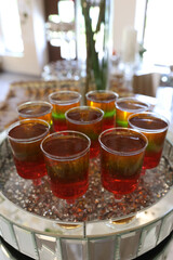 On the buffet table, a gelatin dessert in a glass bowl.