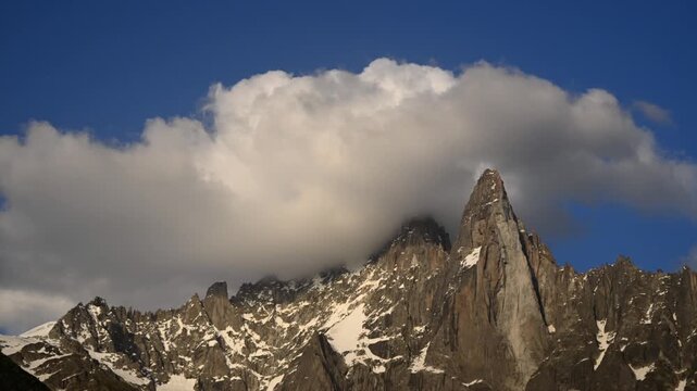 Timelapse of clouds rolling over the jagged peaks at the Aiguille du Midi and Mont Blanc