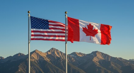 United States and Canada flags wave proudly with picturesque mountain backdrop beneath a clear