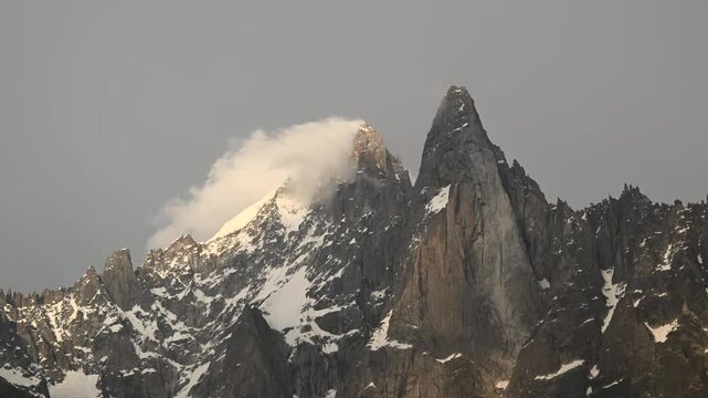 Timelapse of clouds rolling over the jagged peaks at the Aiguille du Midi and Mont Blanc