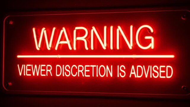 Bright Red Neon Sign with 'Warning Viewer Discretion Is Advised' Text, Glowing on a Dark Background, Ideal for Content Advisory and Media Notificat...