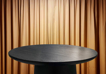 Minimalist black wooden round coffee table on gold curtain background ideal for modern luxury product display, or interior design concepts.
