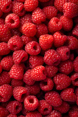 Close-up of fresh red raspberries filling the frame