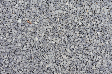 Rugged Grey Crushed Stone Gravel Background Revealing Natural Texture and Durable Resilience for Construction and Landscaping Design.