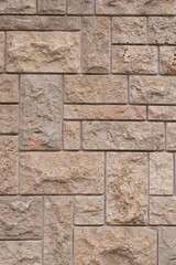 Close-up View of Beige Natural Stone Wall Texture