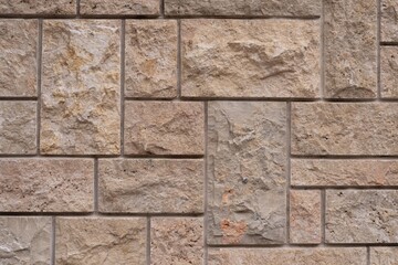 Close-up View of Beige Natural Stone Wall Texture