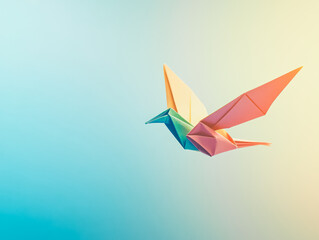 Colorful origami bird is flying in the sky. The bird is made of paper and has a unique design. The image has a bright and cheerful mood, and it conveys the idea of creativity and artistry
