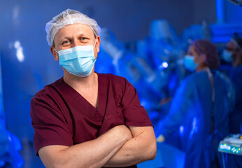 Surgeon prepares for a complex operation. A skilled surgeon is ready for surgery, wearing scrubs...