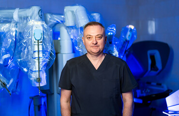 Surgeon in modern operating room setting. A surgeon stands confidently in a high-tech operating...