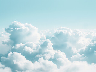 Soft white clouds drifting against light blue sky