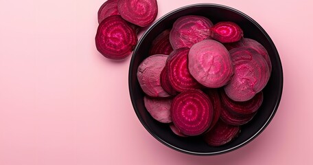 Against a backdrop of pastel pink, a black bowl containing sliced beets displays circular patterns and vivid magenta tones, Generative AI.