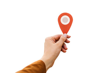 Person's hand grasping orange-red GPS location pin with white center for geographic positioning, isolated on a transparent background