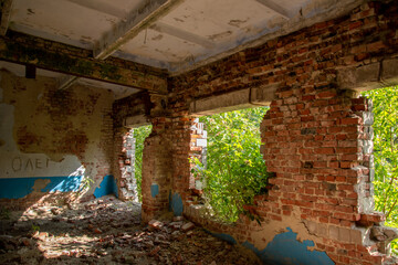 A room with a brick wall and a window in it