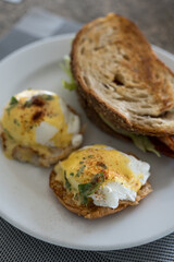 A delicious eggs Benedict with Hollandaise Sauce, ready to enjoy.