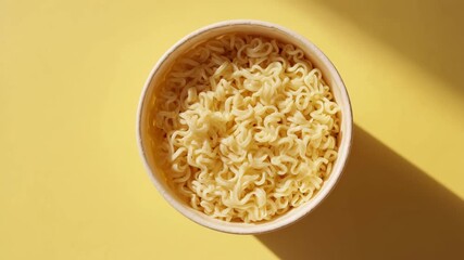 boiling ramyun noodles in a bowl - Powered by Adobe