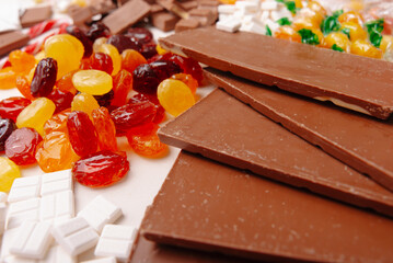 A delightful assortment of chocolate bars, gummy candies, and an array of sweet treats ideal for any occasion