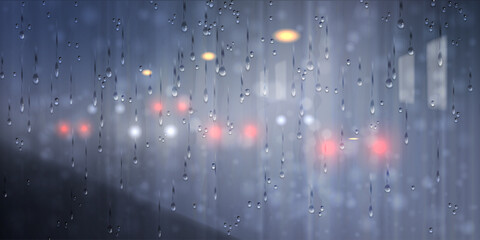 Raindrops flowing down the window with streetlights and car headlights, city night scene. Abstract background of city life at night during the rainy season.