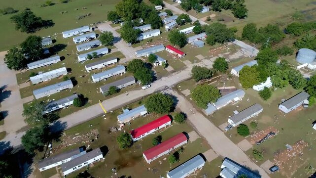 An aerial view shows a mobile home park in a rural area