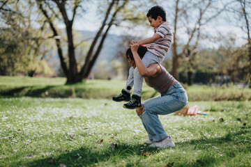 Fototapeta premium A lively depiction of a mother and her son enjoying quality time in nature's playground. Their laughter and bond bring this sunny park scene to life, evoking feelings of happiness and togetherness.