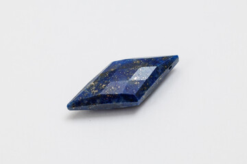 Lapis Lazuli Rhombus Cut Gemstone with Pyrite on White Background

