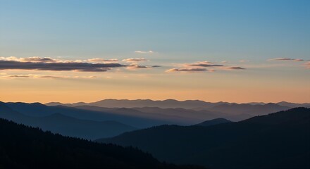 Obraz premium A clear, crisp autumn sky with a few wispy, auspicious clouds, serving as a backdrop for a distant silhouette of multiple mountain peaks