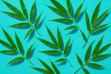 Fototapeta premium A serene blue canvas adorned with vibrant green bamboo leaves, creating a harmonious blend of nature's simplicity