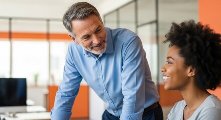 Two men in a office setting, engaged in a conversation.