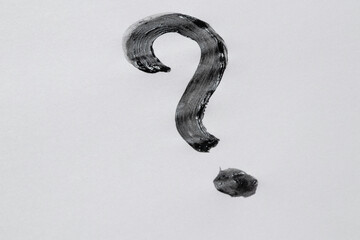 Watercolor question mark black on white background as a question symbol drawn with a brush in black...