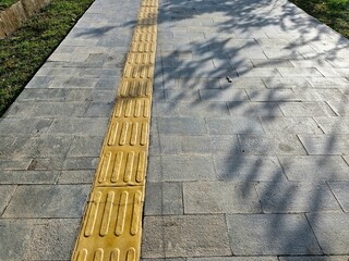 Pedestrian path, complete with signs for the blind