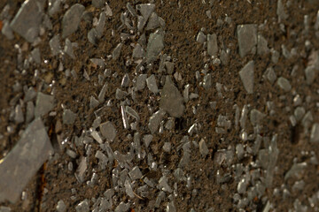 This is a closeup shot capturing the detailed texture and various shapes of a pile of rocks that are found on the ground