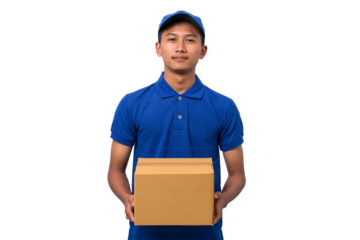 Smiling young asian delivery man wearing blue uniform holding cardboard box on white background
