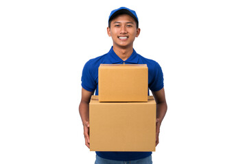 Smiling young asian delivery man wearing blue uniform holding cardboard box on white background