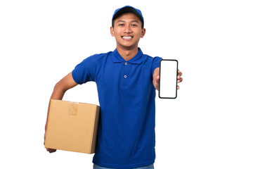 Asian delivery man wearing blue uniform holding cardboard box showing smartphone with blank screen