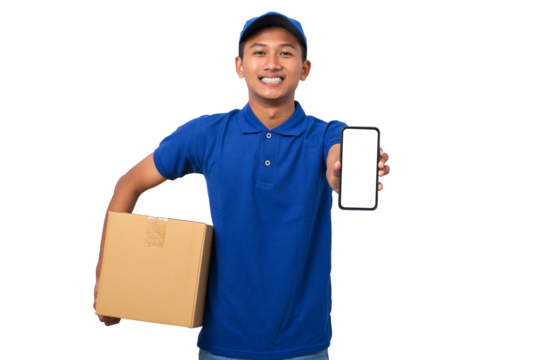 Asian delivery man wearing blue uniform holding cardboard box showing smartphone with blank screen