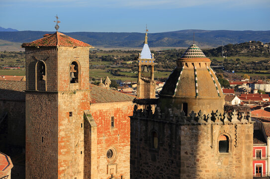 Spain, Extremadura, Caceres, Church tower in the historical center of the medieval town of Trujillo in the late afternoon sunshine. Birth place of Fransisco Pizarro - 'The Conqueror of Peru'. - Powered by Adobe
