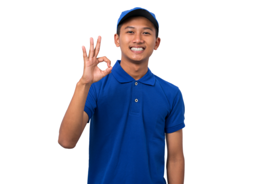 Young asian delivery man wearing blue uniform gesturing Ok sign with finger on white background