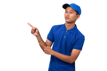 Smiling young asian delivery man wearing blue uniform pointing present a product