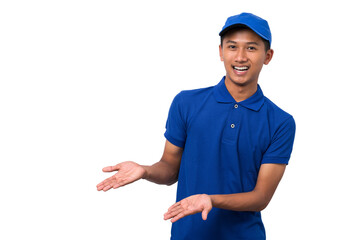 Smiling young asian delivery man wearing blue uniform pointing present a product