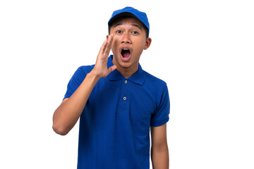 Young asian delivery man wearing blue uniform screaming shouting