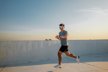 Joining the morning run under the clear blue sky on a sunlit rooftop