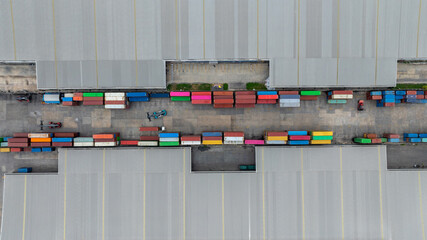 Aerial view semi truck cargo trailer at logistic park warehouse goods, Distribution warehouse...