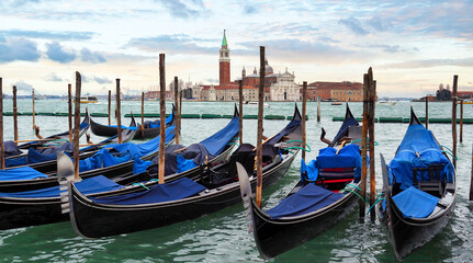 gondolas and the Church of the Santissimo Redentore on the Giudecca island in Venice