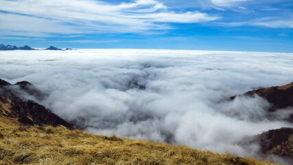 a magnificent sea of ​​clouds under the crest of the Parma Apennines
