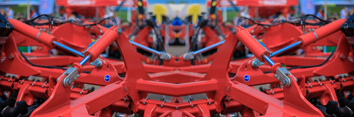 Agricultural machinery and parts of mechanisms on a sunny day. Texture, background for design. 