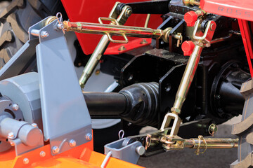 Agricultural machinery and parts of mechanisms on a sunny day. Texture, background for design.