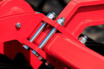 Fototapeta premium Agricultural machinery and parts of mechanisms on a sunny day. Texture, background for design. 