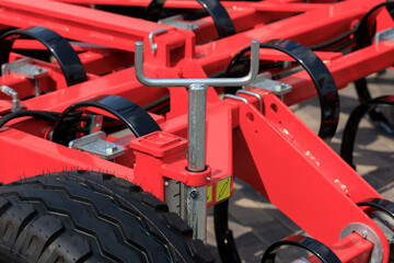Agricultural machinery and parts of mechanisms on a sunny day. Texture, background for design. 