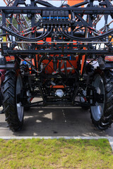 Fototapeta premium Agricultural machinery and parts of mechanisms on a sunny day. Texture, background for design. 